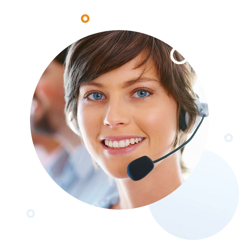 A young woman with short hair has a headset on with a wrap around microphone in front of her chin. She is smiling.